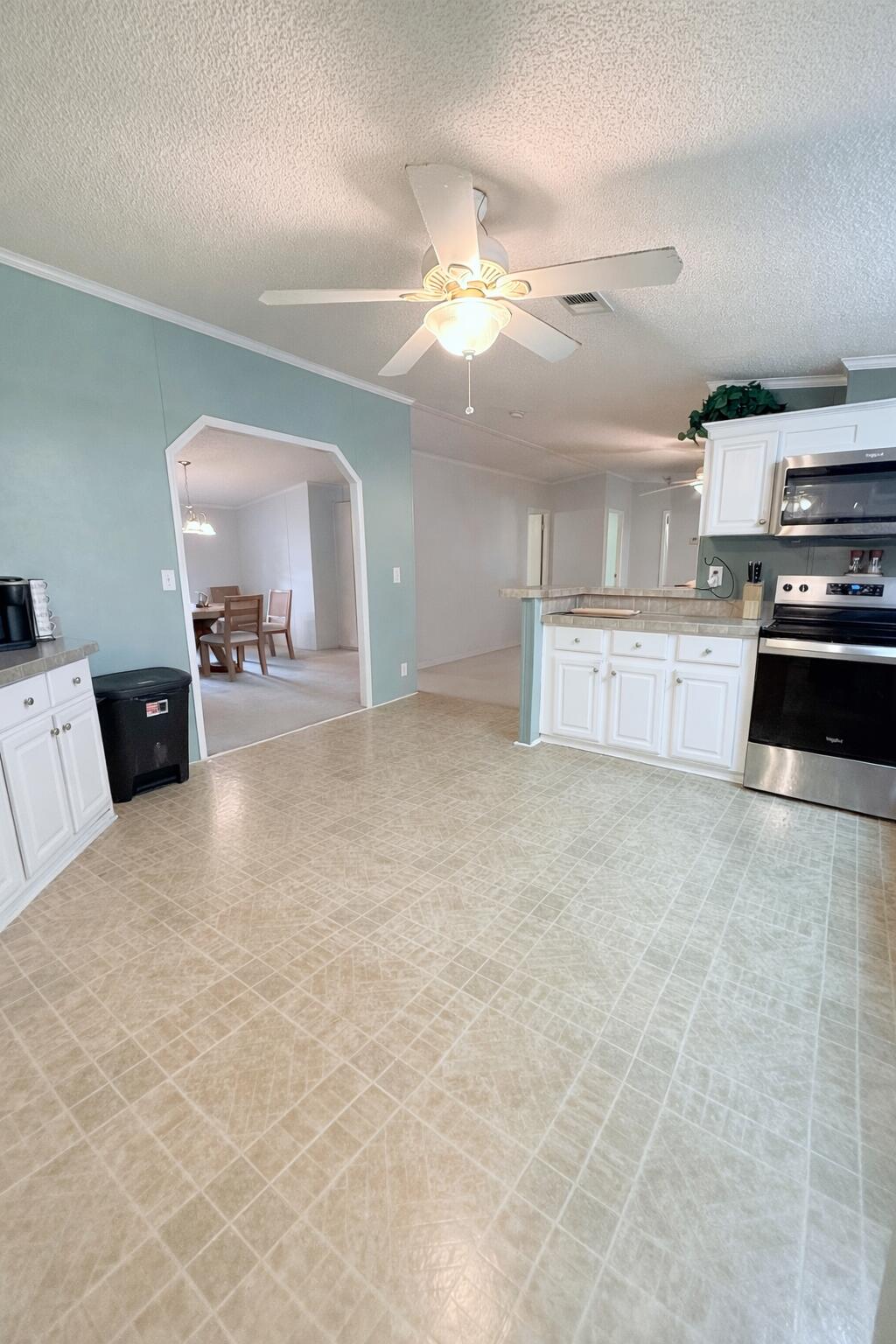 4096 Southwest 9th Way Okeechobee, FL 34974 - Photo 22 of 36 a large kitchen with cabinets