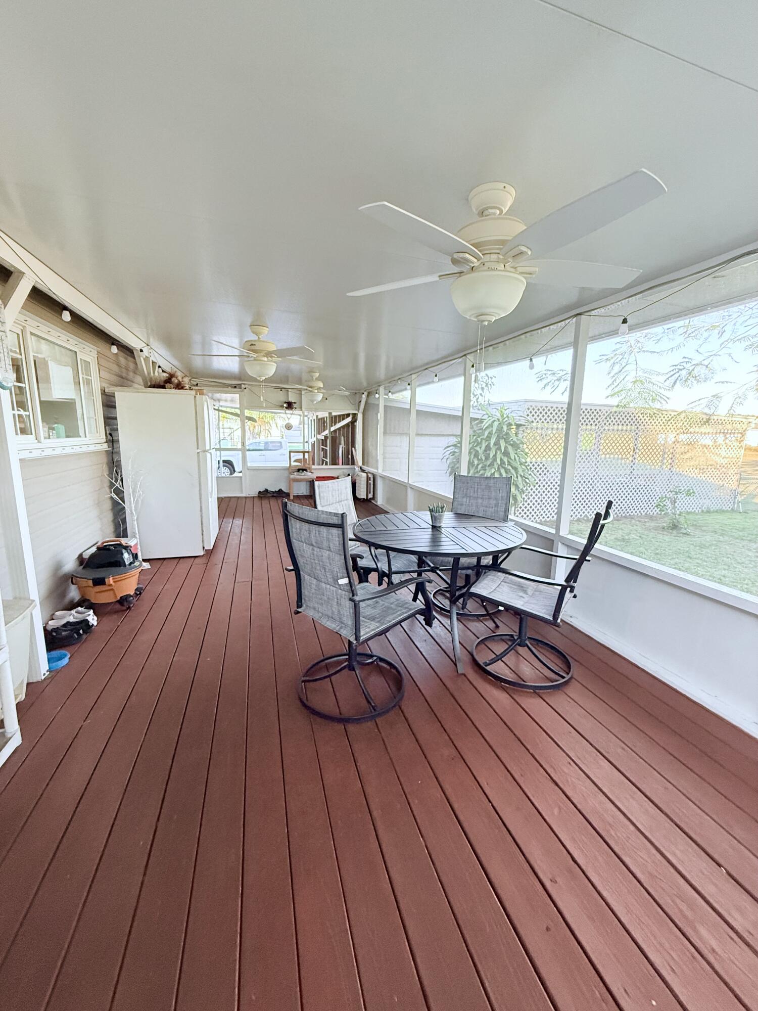 4096 Southwest 9th Way Okeechobee, FL 34974 - Photo 26 of 36 a outdoor space with wooden floor and glass door