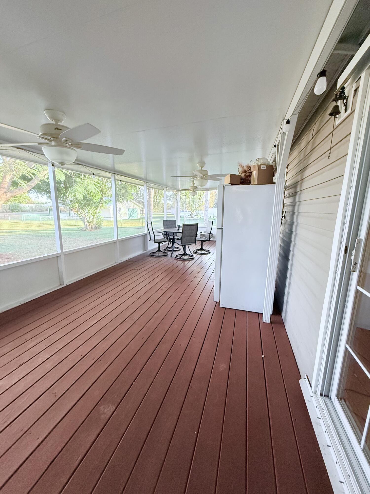 4096 Southwest 9th Way Okeechobee, FL 34974 - Photo 27 of 36 a view of a house with wooden floor and outdoor space