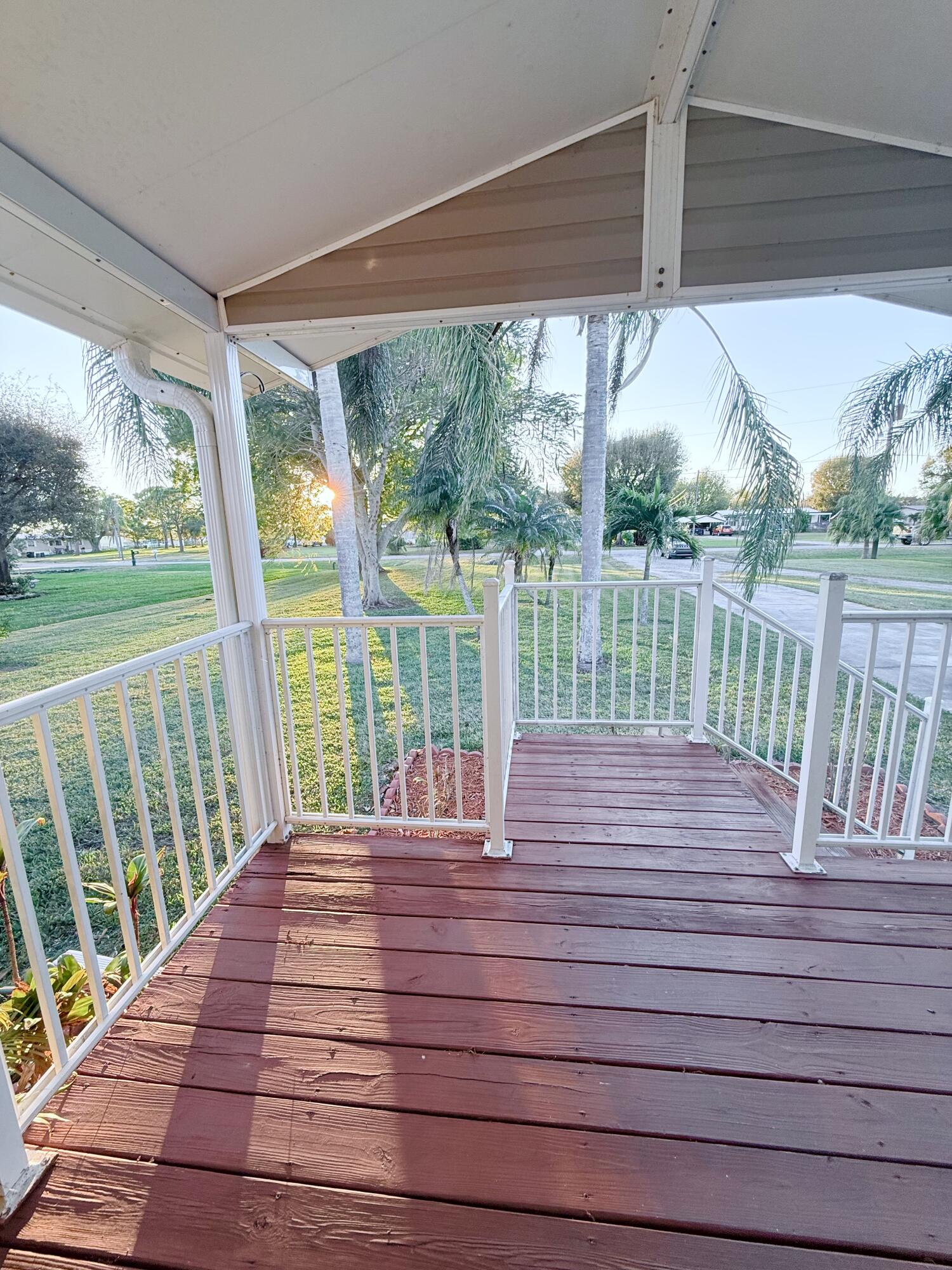 4096 Southwest 9th Way Okeechobee, FL 34974 - Photo 6 of 36 a view of balcony with wooden floor and fence
