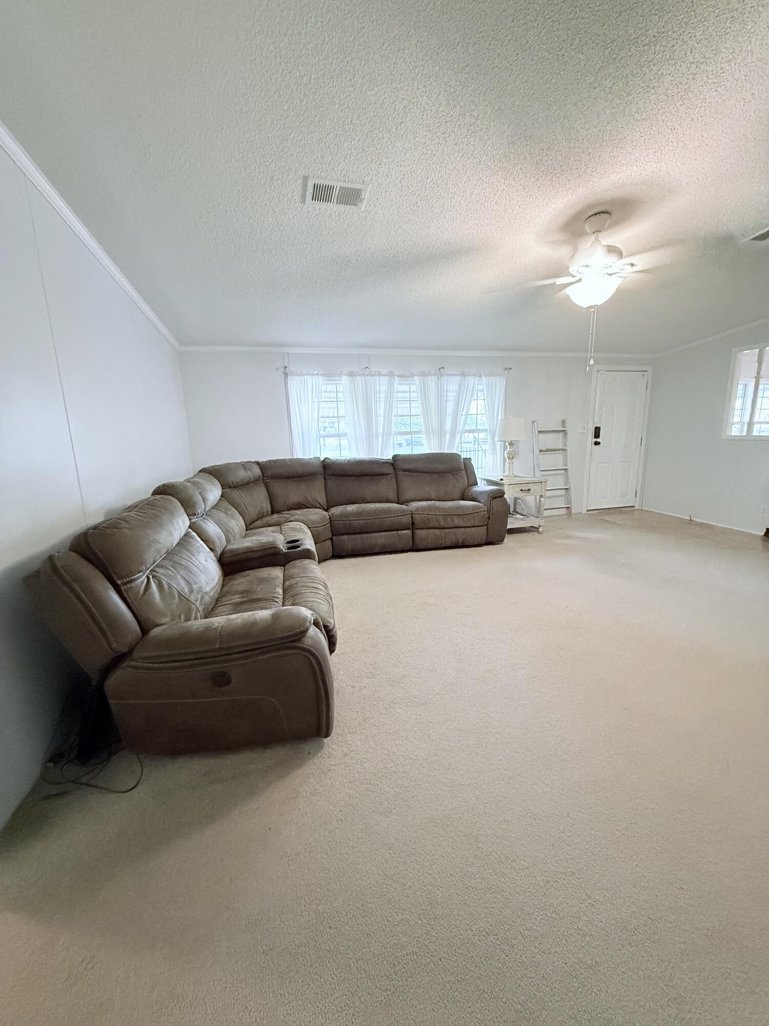 4096 Southwest 9th Way Okeechobee, FL 34974 - Photo 7 of 36 a living room with furniture and a couch