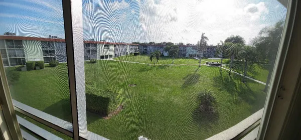 a view of swimming pool from a balcony