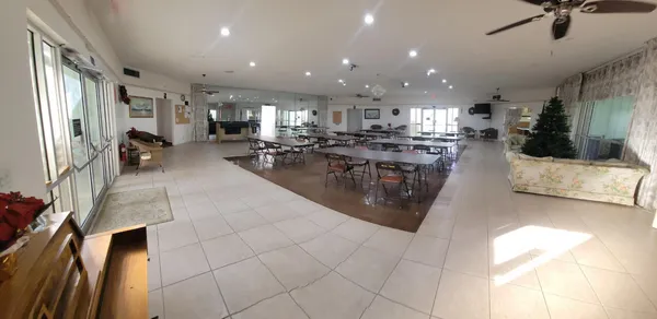 a lobby with furniture and a potted plant