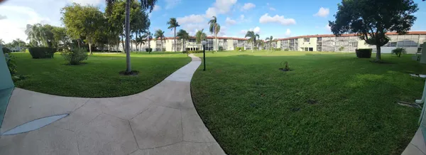 a view of a golf course with a house