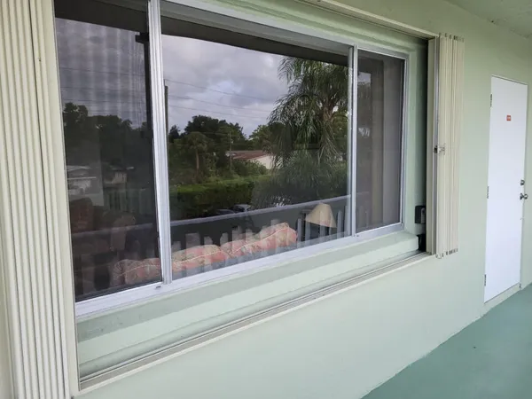 a view of a glass door and a window