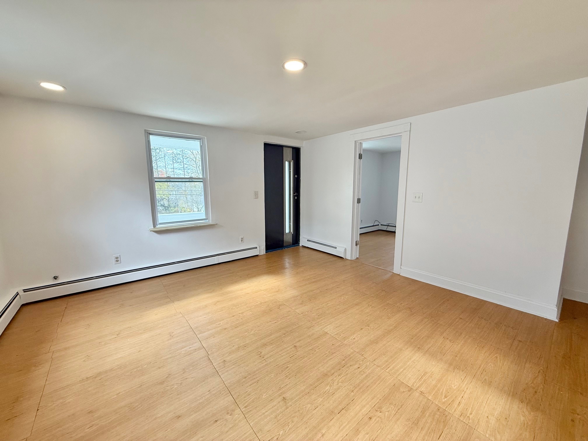 261 Hillside Avenue, Unit 2 Torrington, CT 06790 - Photo 5 of 10 an empty room with a empty space and window