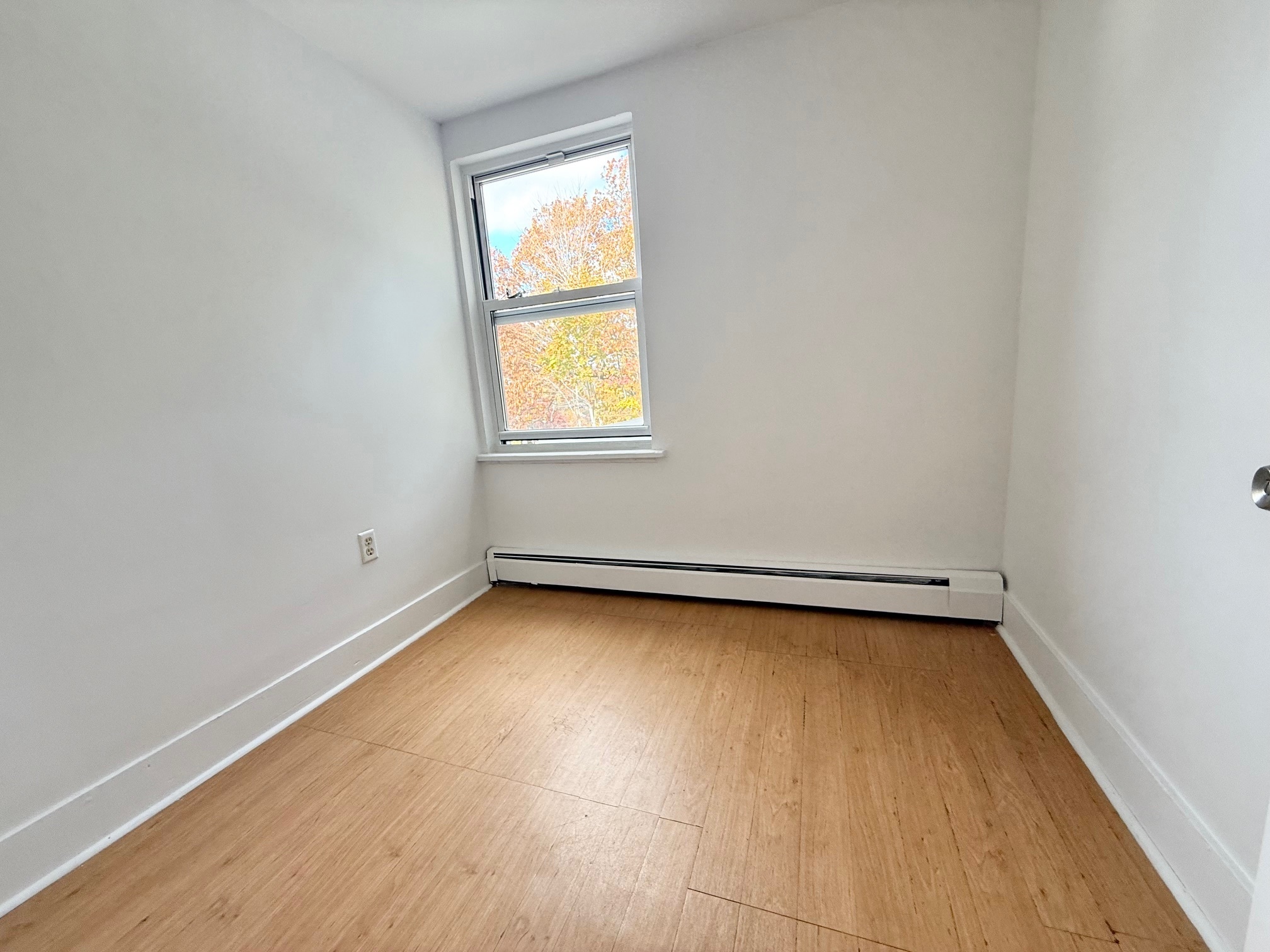 261 Hillside Avenue, Unit 2 Torrington, CT 06790 - Photo 9 of 10 an empty room with a window