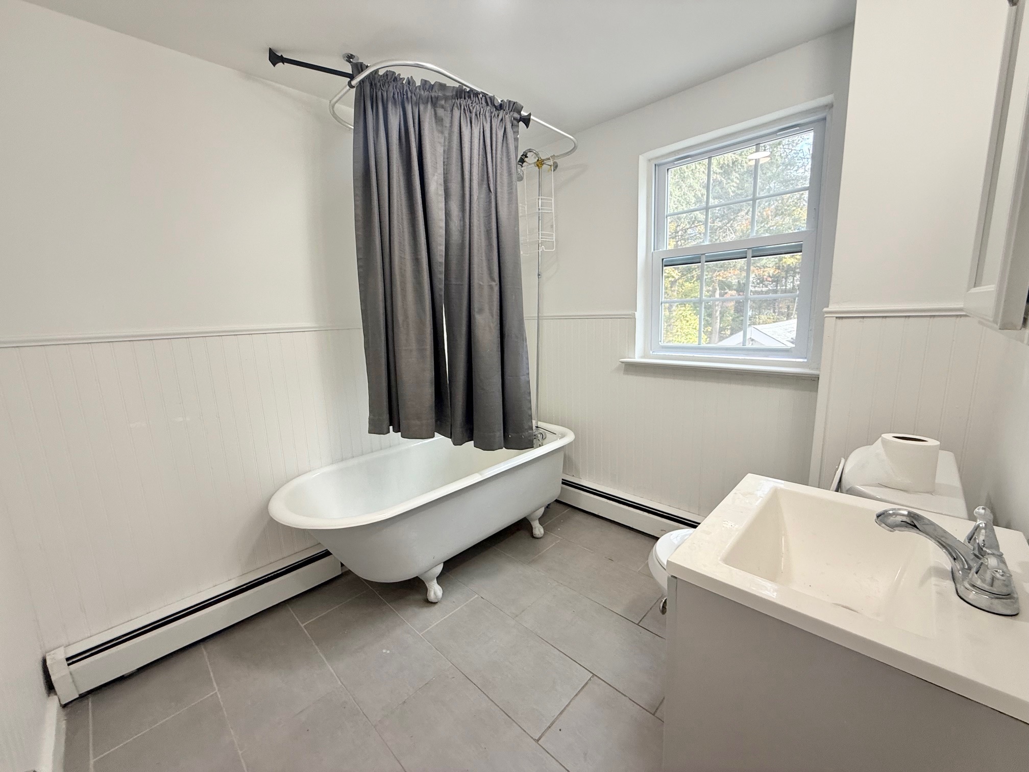 261 Hillside Avenue, Unit 2 Torrington, CT 06790 - Photo 10 of 10 a bathroom with a sink and a mirror