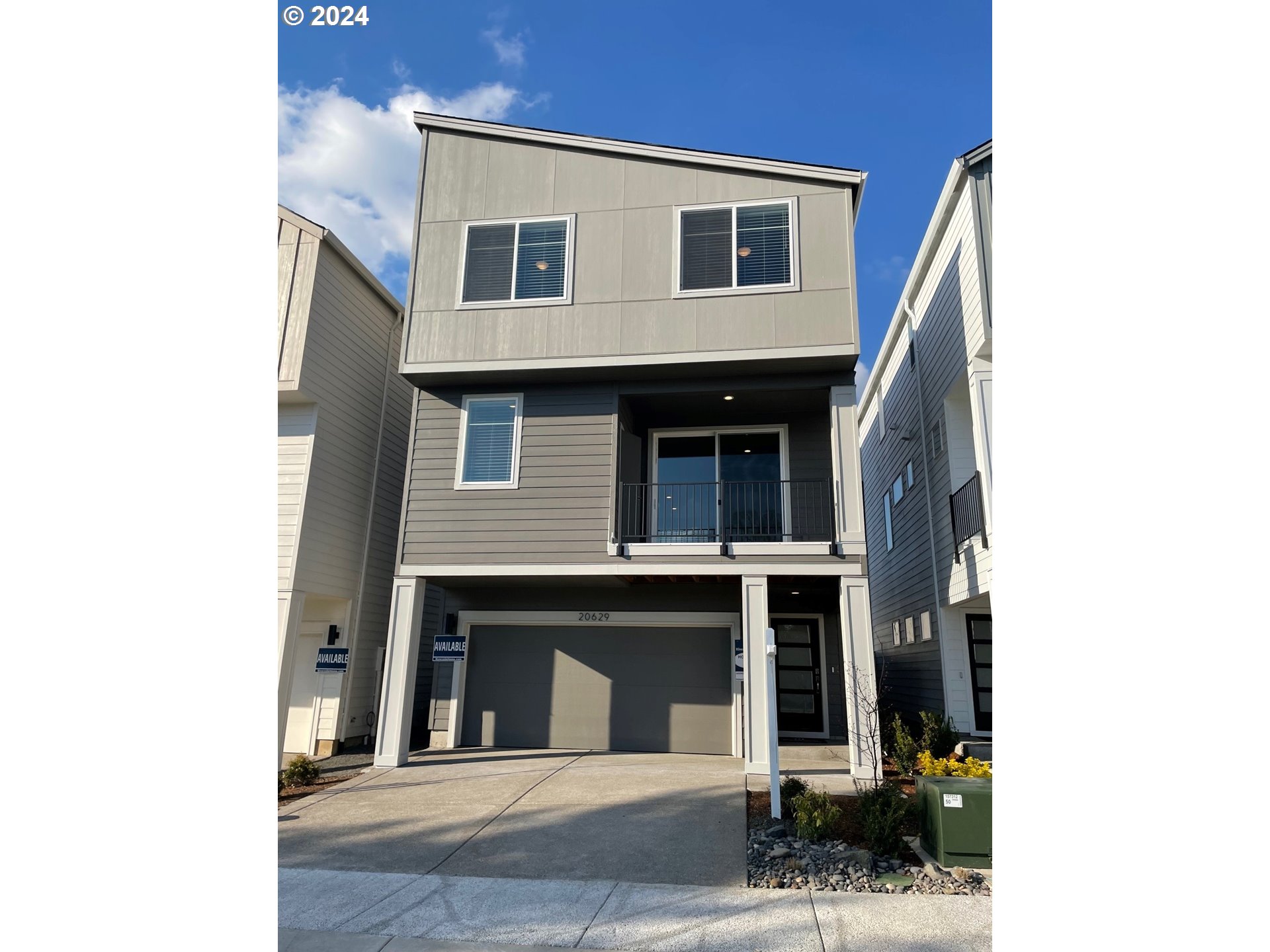 20629 Southwest Boyd Court, Unit 3 Beaverton, OR 97003 - Photo 1 of 46 a view of a house with a garage