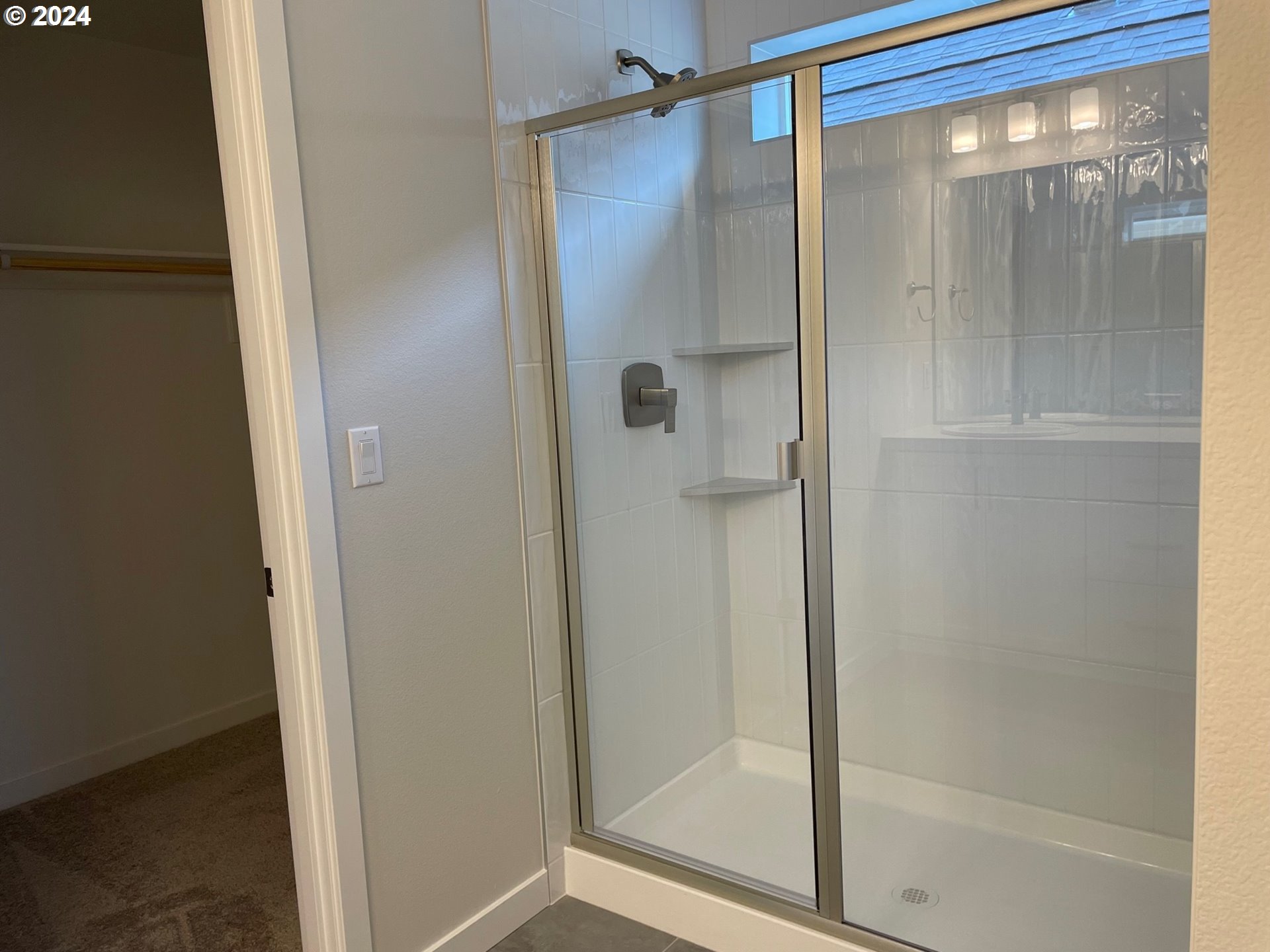 20629 Southwest Boyd Court, Unit 3 Beaverton, OR 97003 - Photo 11 of 46 a bathroom with a glass shower door