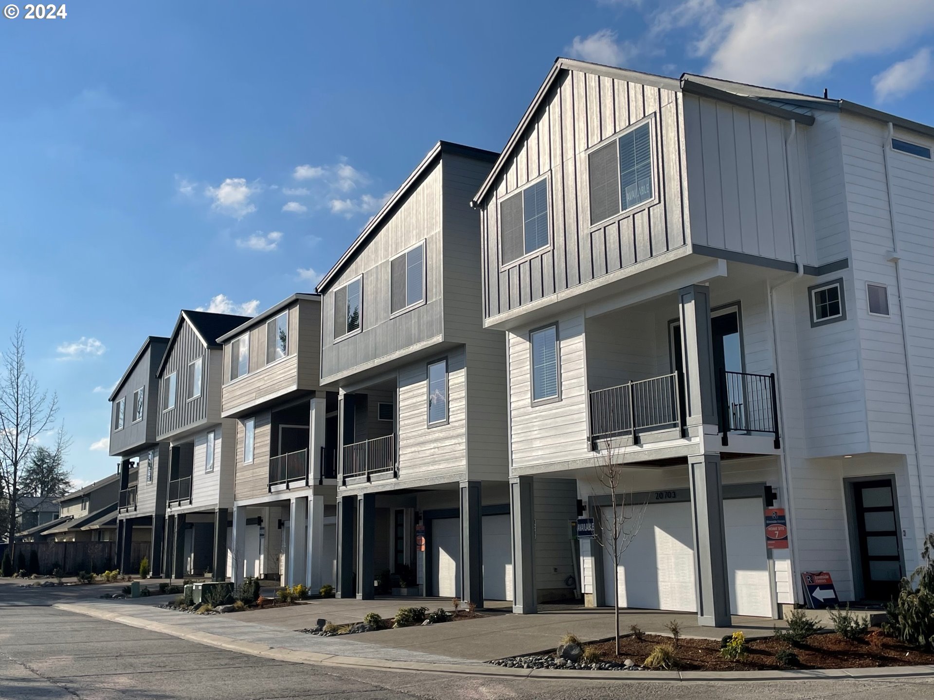 20629 Southwest Boyd Court, Unit 3 Beaverton, OR 97003 - Photo 14 of 46 a front view of a building and a street