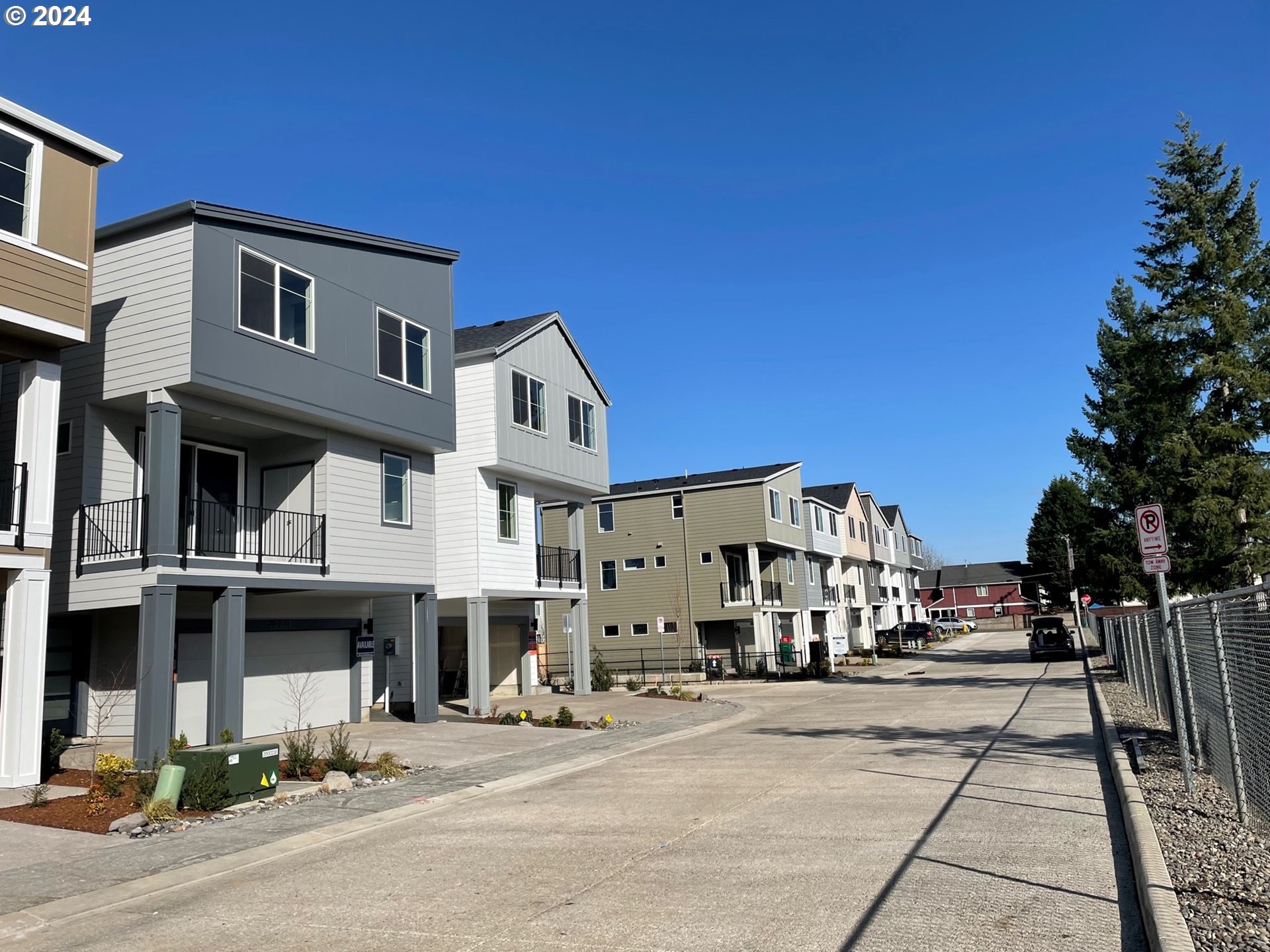 20629 Southwest Boyd Court, Unit 3 Beaverton, OR 97003 - Photo 15 of 46 a front view of a building with street