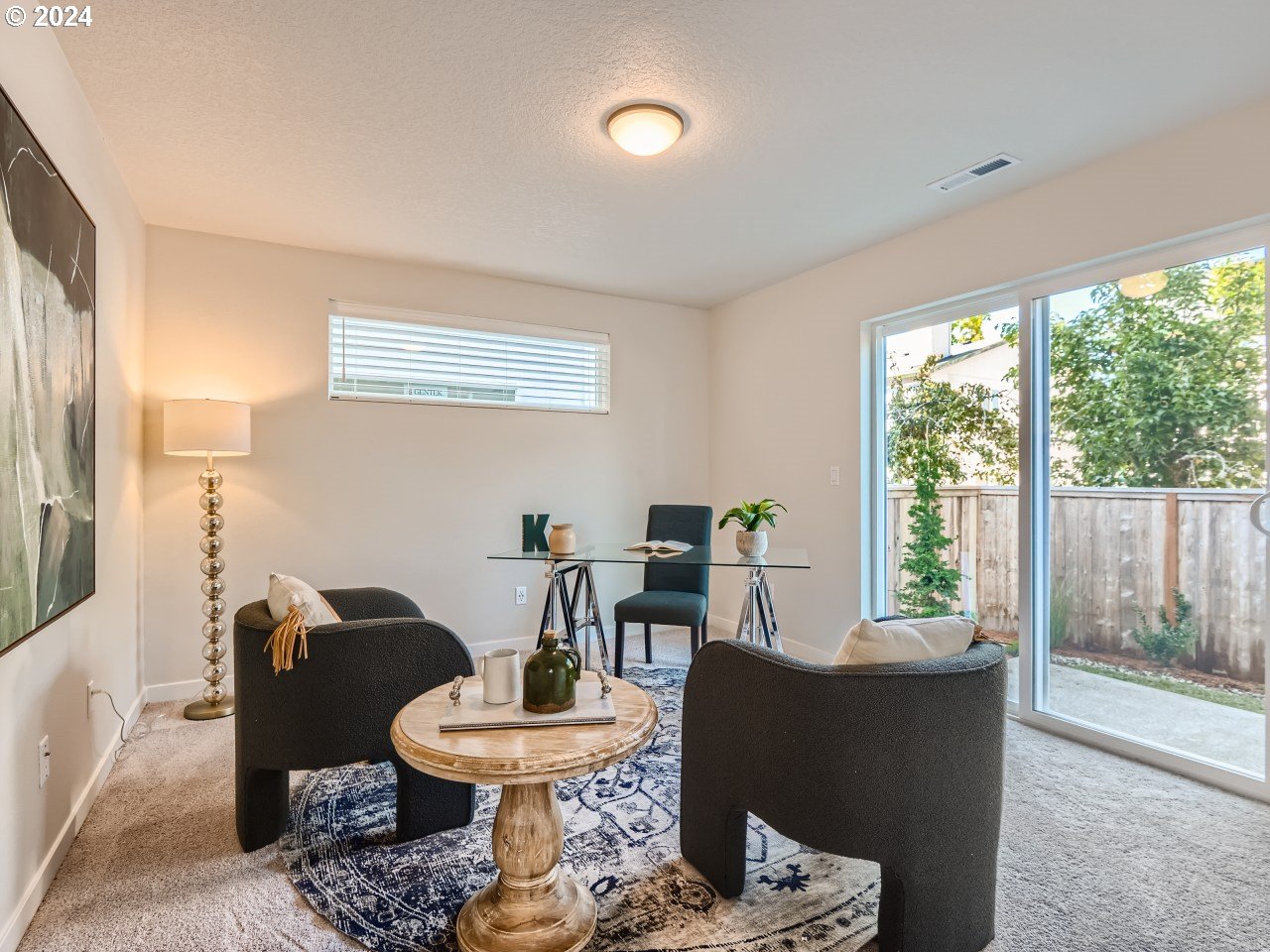 20629 Southwest Boyd Court, Unit 3 Beaverton, OR 97003 - Photo 18 of 46 a living room with furniture and a large window