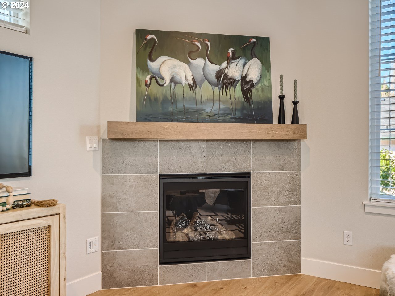20629 Southwest Boyd Court, Unit 3 Beaverton, OR 97003 - Photo 20 of 46 a view of a fireplace with painting on the wall
