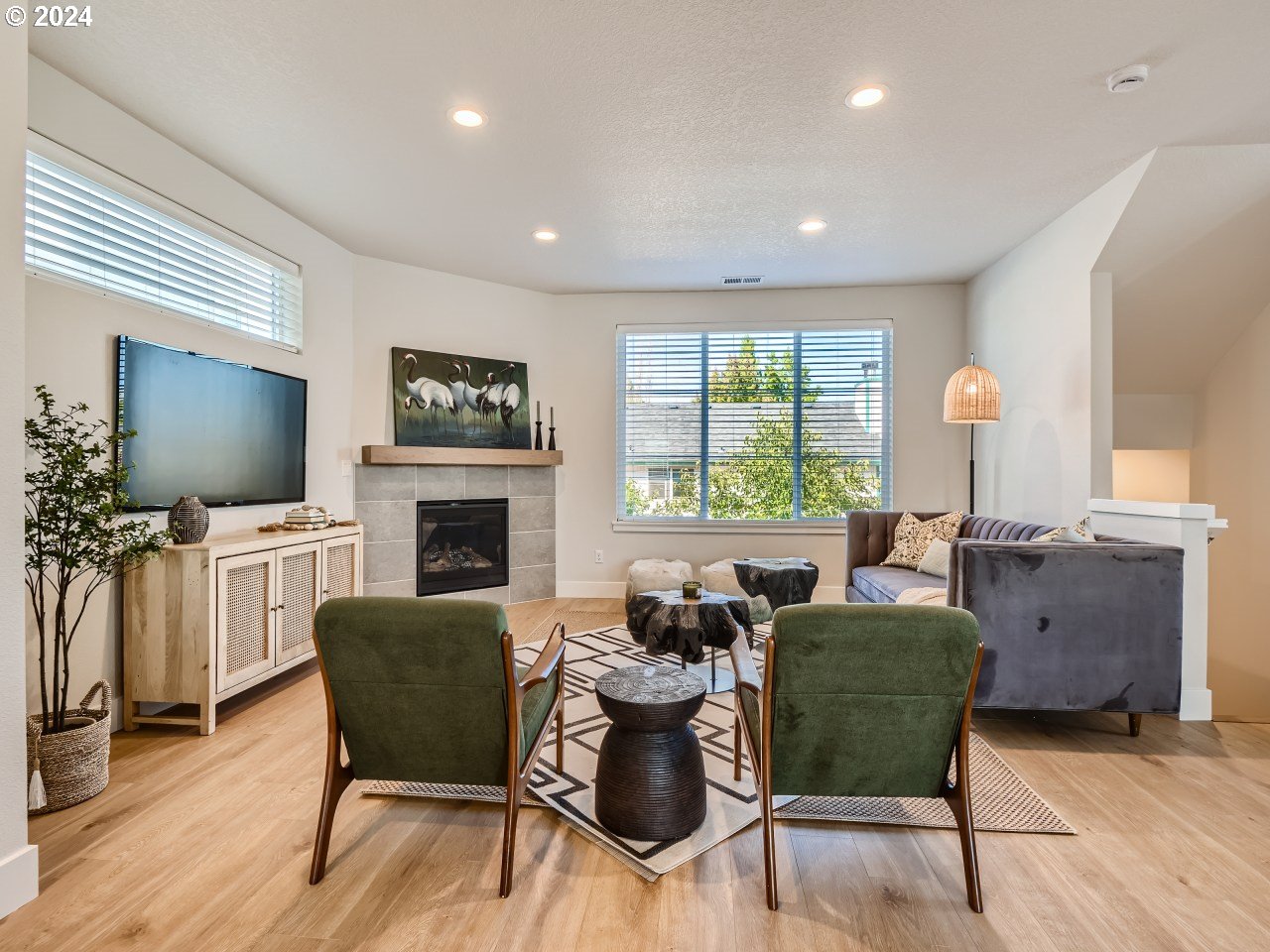 20629 Southwest Boyd Court, Unit 3 Beaverton, OR 97003 - Photo 21 of 46 a living room with furniture a flat screen tv and a fireplace