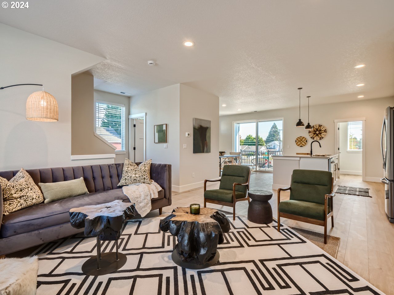 20629 Southwest Boyd Court, Unit 3 Beaverton, OR 97003 - Photo 22 of 46 a living room with furniture and a large window