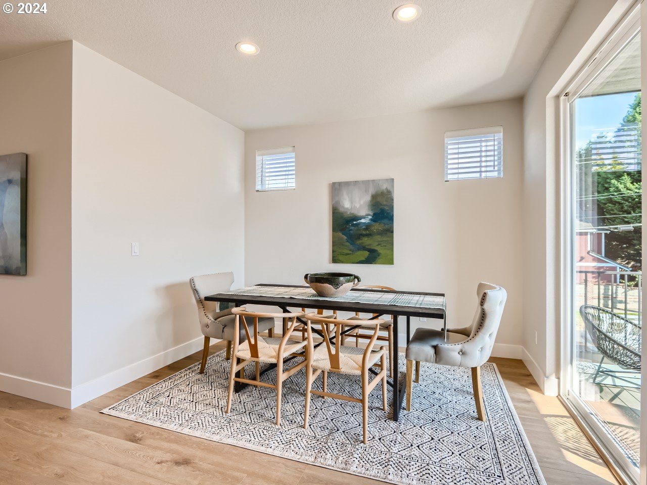 20629 Southwest Boyd Court, Unit 3 Beaverton, OR 97003 - Photo 27 of 46 a view of a dining room with furniture and wooden floor