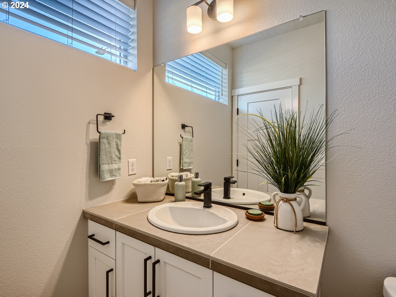 20629 Southwest Boyd Court, Unit 3 Beaverton, OR 97003 - Photo 29 of 46 a bathroom with a sink and a mirror