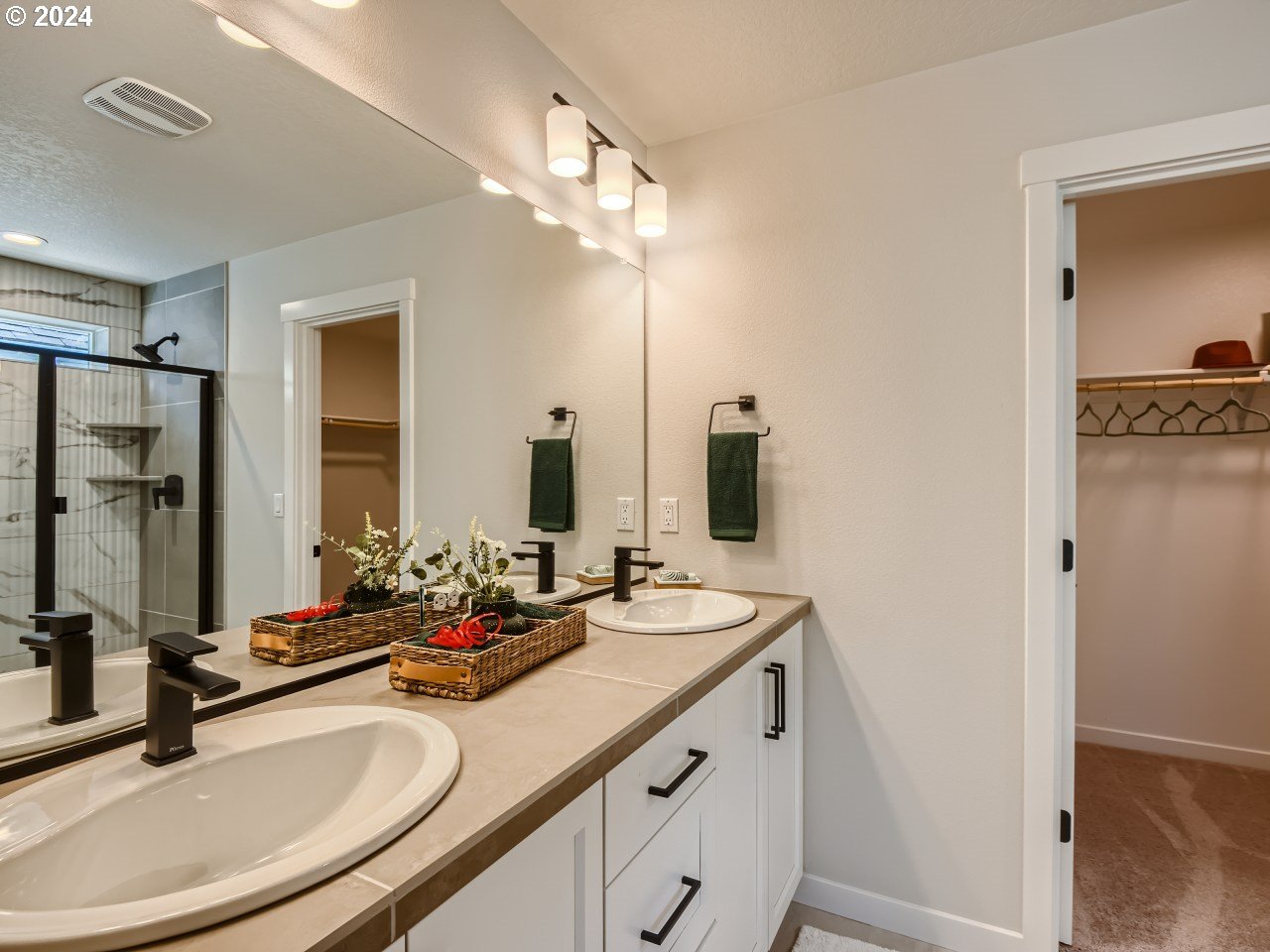 20629 Southwest Boyd Court, Unit 3 Beaverton, OR 97003 - Photo 32 of 46 a bathroom with double vanity sinks and a mirror