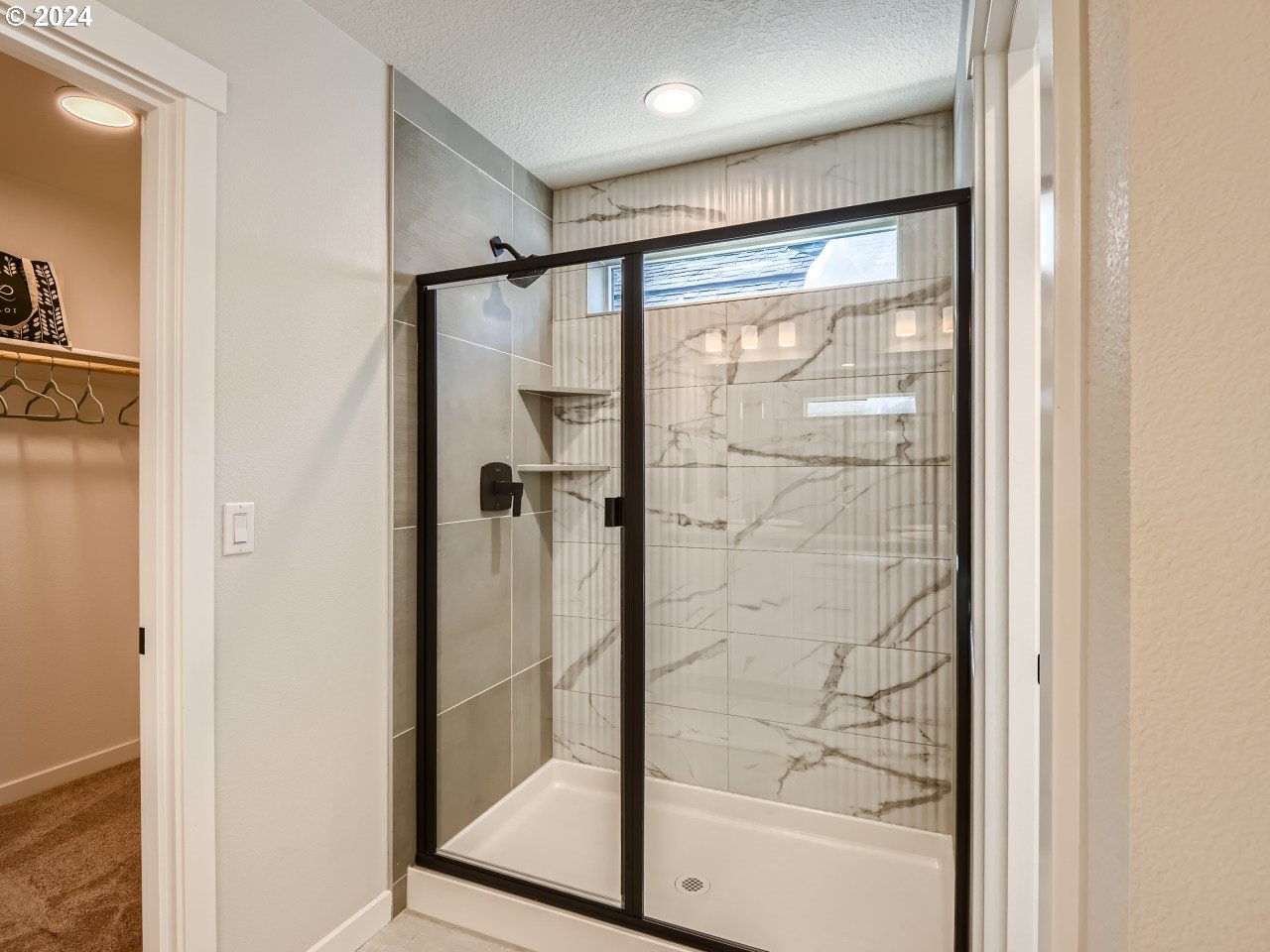 20629 Southwest Boyd Court, Unit 3 Beaverton, OR 97003 - Photo 34 of 46 a bathroom with a glass shower door