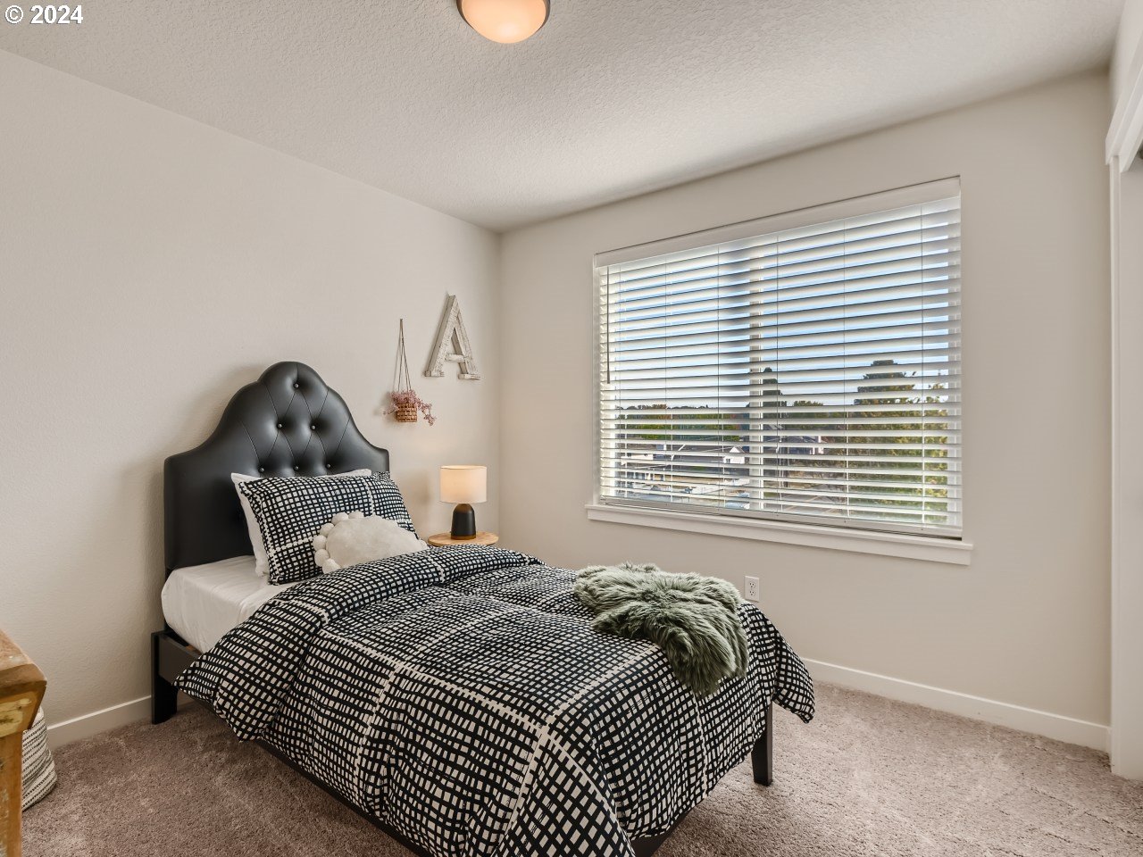 20629 Southwest Boyd Court, Unit 3 Beaverton, OR 97003 - Photo 35 of 46 a bedroom with a bed and a window