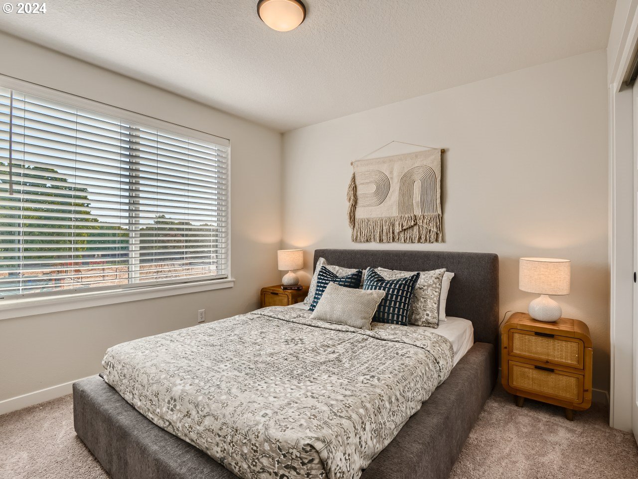 20629 Southwest Boyd Court, Unit 3 Beaverton, OR 97003 - Photo 36 of 46 a bedroom with bed and window