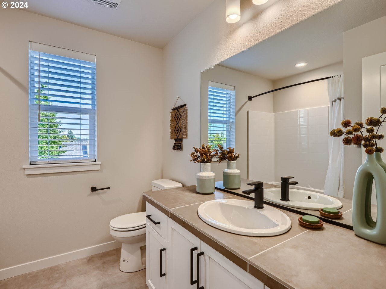 20629 Southwest Boyd Court, Unit 3 Beaverton, OR 97003 - Photo 37 of 46 a bathroom with a granite countertop sink toilet and mirror