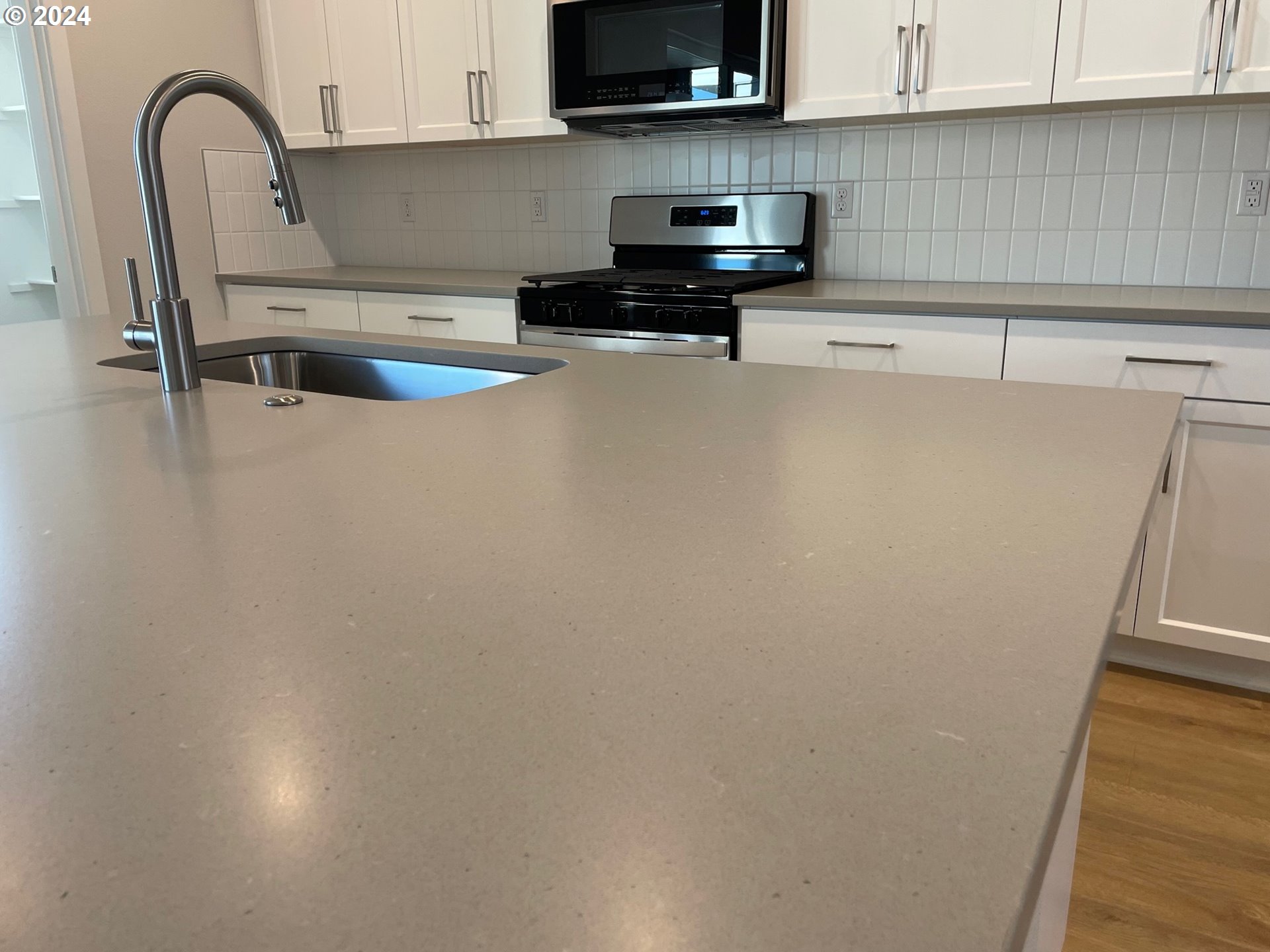 20629 Southwest Boyd Court, Unit 3 Beaverton, OR 97003 - Photo 6 of 46 a kitchen with a sink and a cabinets