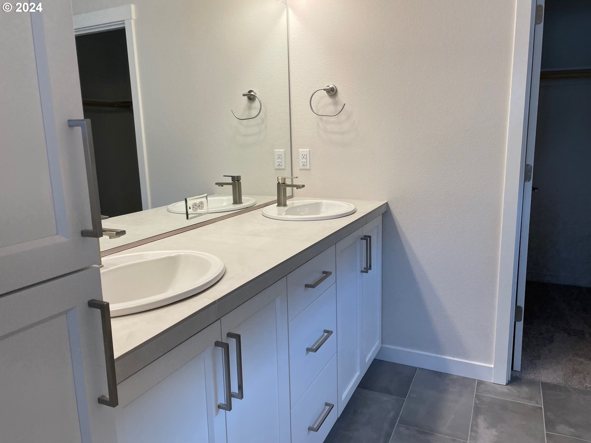 20629 Southwest Boyd Court, Unit 3 Beaverton, OR 97003 - Photo 10 of 46 a bathroom with a sink and a mirror