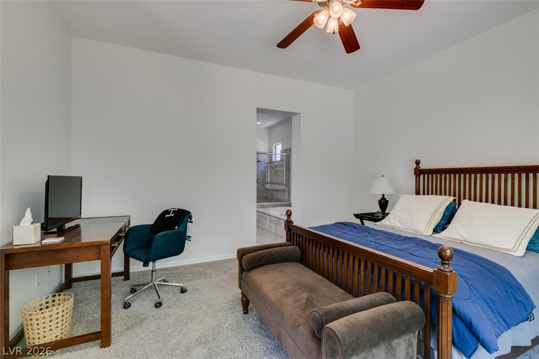 8 Kennesaw Road Henderson, NV 89052 - Photo 30 of 44 Relaxation awaits in this private suite, complete with a dedicated workspace and direct bathroom access.