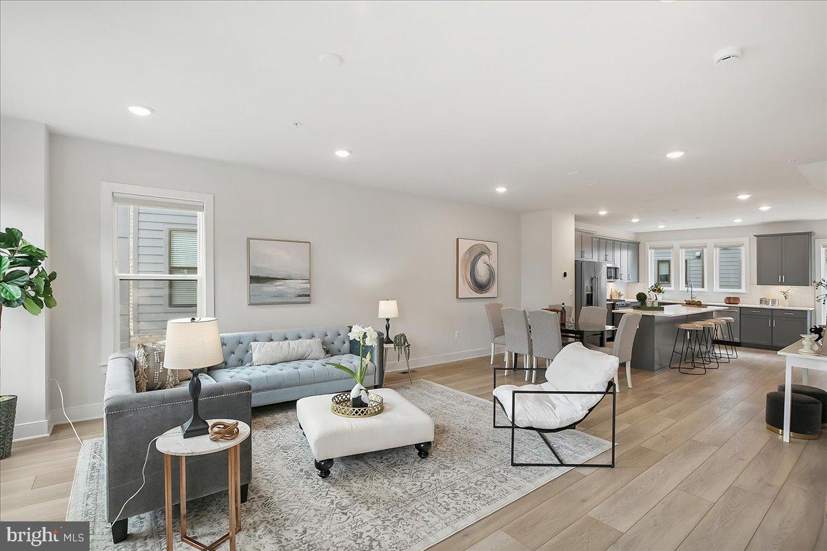 12768 Sunrise Valley Drive Reston, VA 20191 - Photo 17 of 33 a living room with furniture and a table