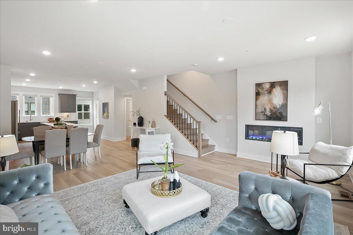 12768 Sunrise Valley Drive Reston, VA 20191 - Photo 33 of 33 a living room with furniture kitchen view and a dining table