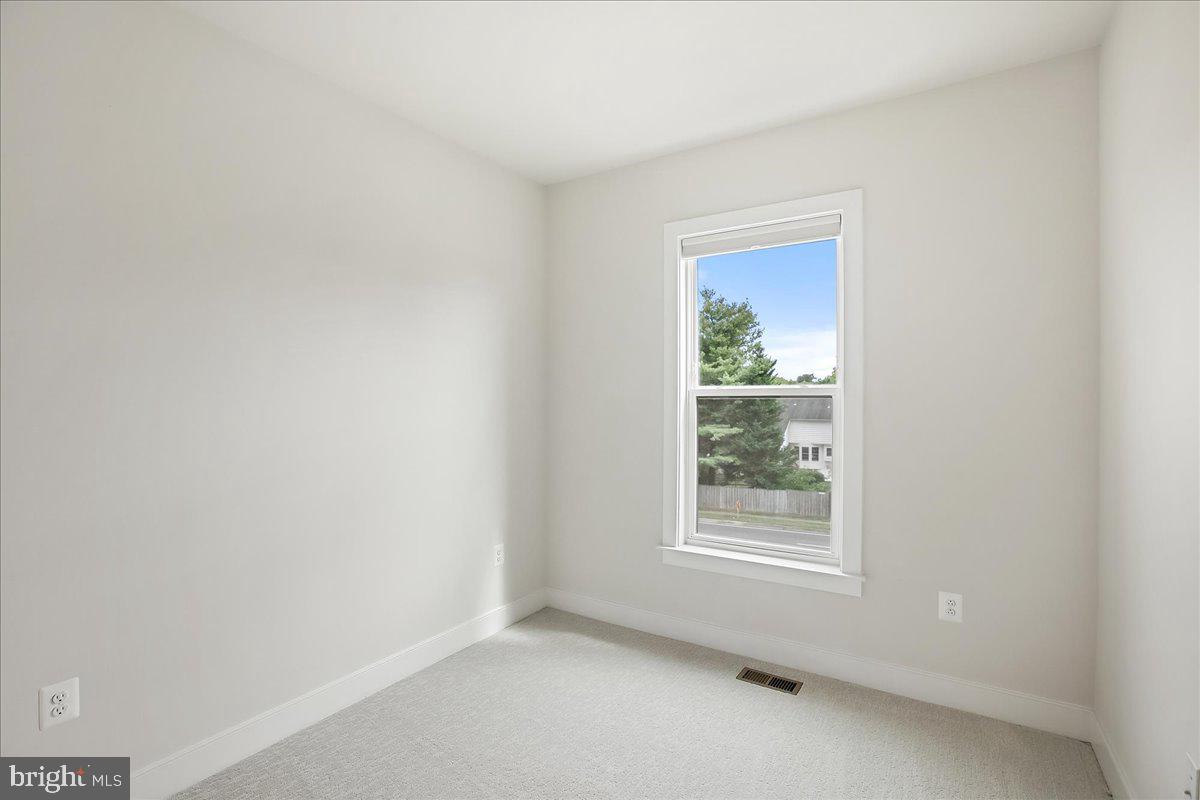 12768 Sunrise Valley Drive Reston, VA 20191 - Photo 22 of 33 a view of an empty room with a window