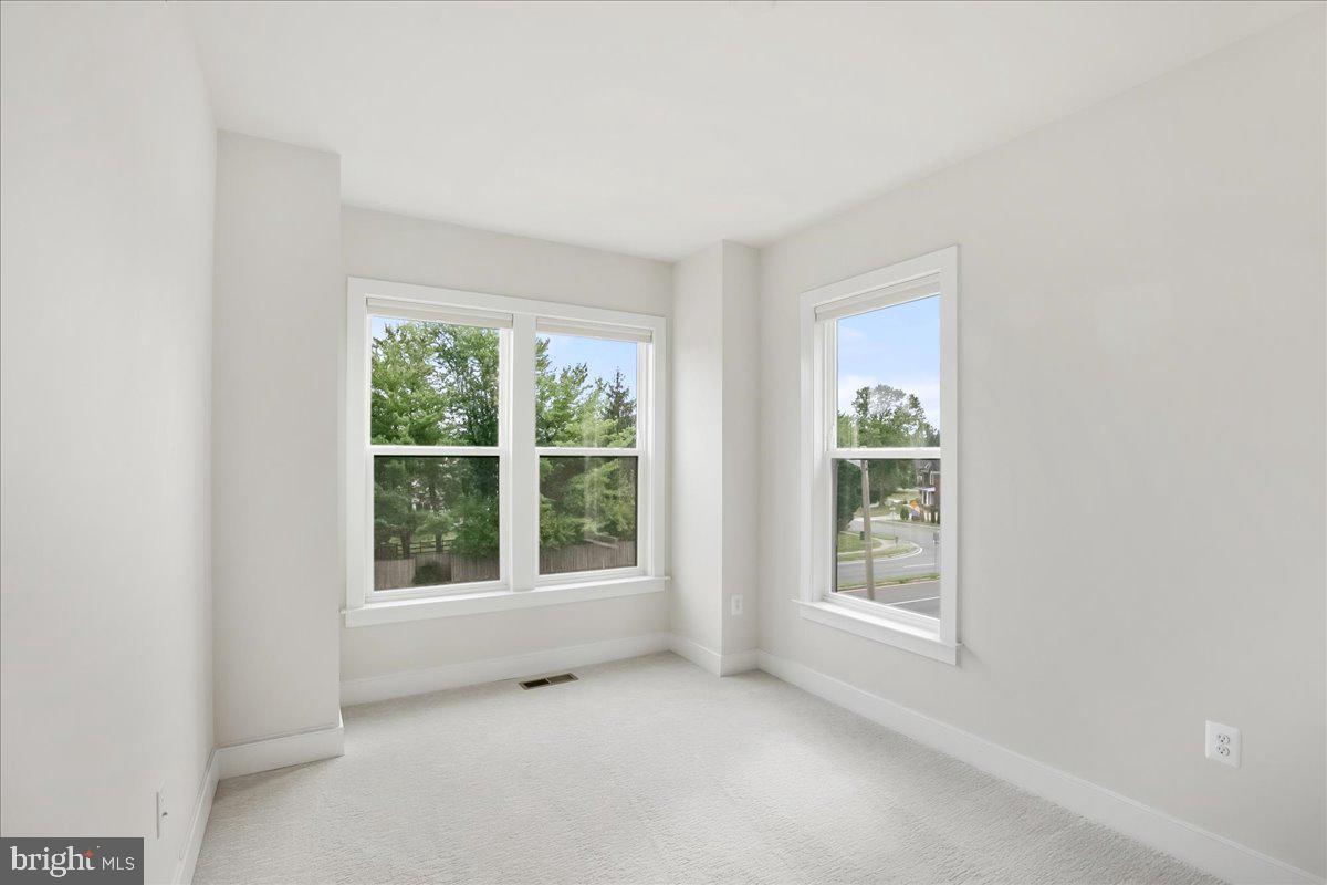 12768 Sunrise Valley Drive Reston, VA 20191 - Photo 23 of 33 an empty room with windows