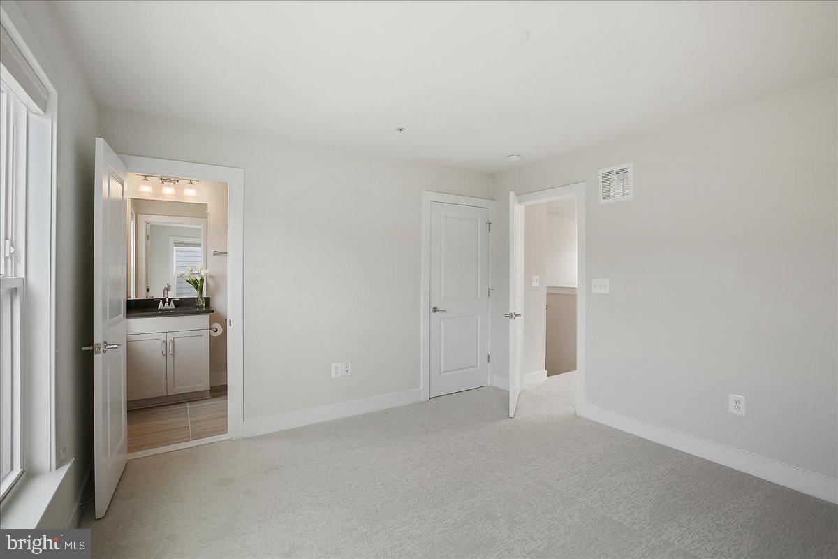 12768 Sunrise Valley Drive Reston, VA 20191 - Photo 27 of 33 a view of a kitchen cabinets and a refrigerator