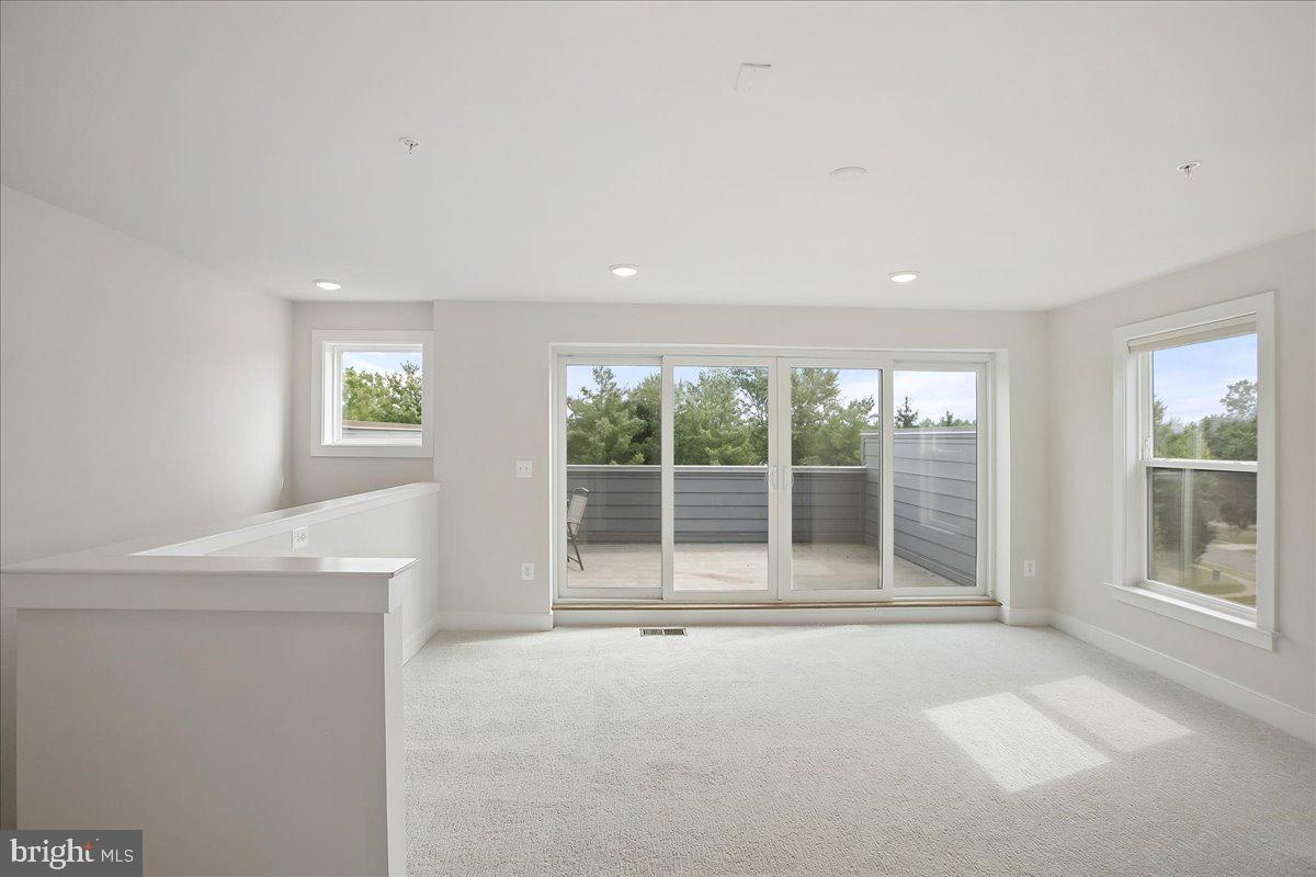 12768 Sunrise Valley Drive Reston, VA 20191 - Photo 29 of 33 a view of an empty room with a window