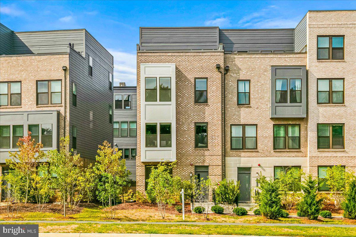 12768 Sunrise Valley Drive Reston, VA 20191 - Photo 31 of 33 a front view of a house with a yard