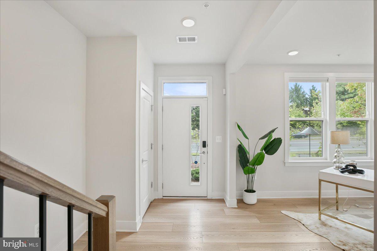 12768 Sunrise Valley Drive Reston, VA 20191 - Photo 5 of 33 a view of entryway with wooden floor