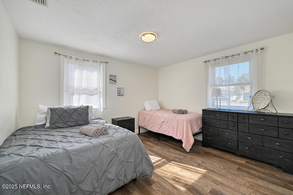 1907 Penman Road Jacksonville Beach, FL 32250 - Photo 10 of 27 a bedroom with two beds and a window