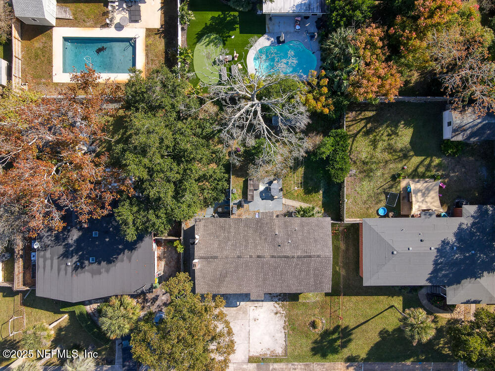 1907 Penman Road Jacksonville Beach, FL 32250 - Photo 3 of 27 an aerial view of a house with a yard and garden