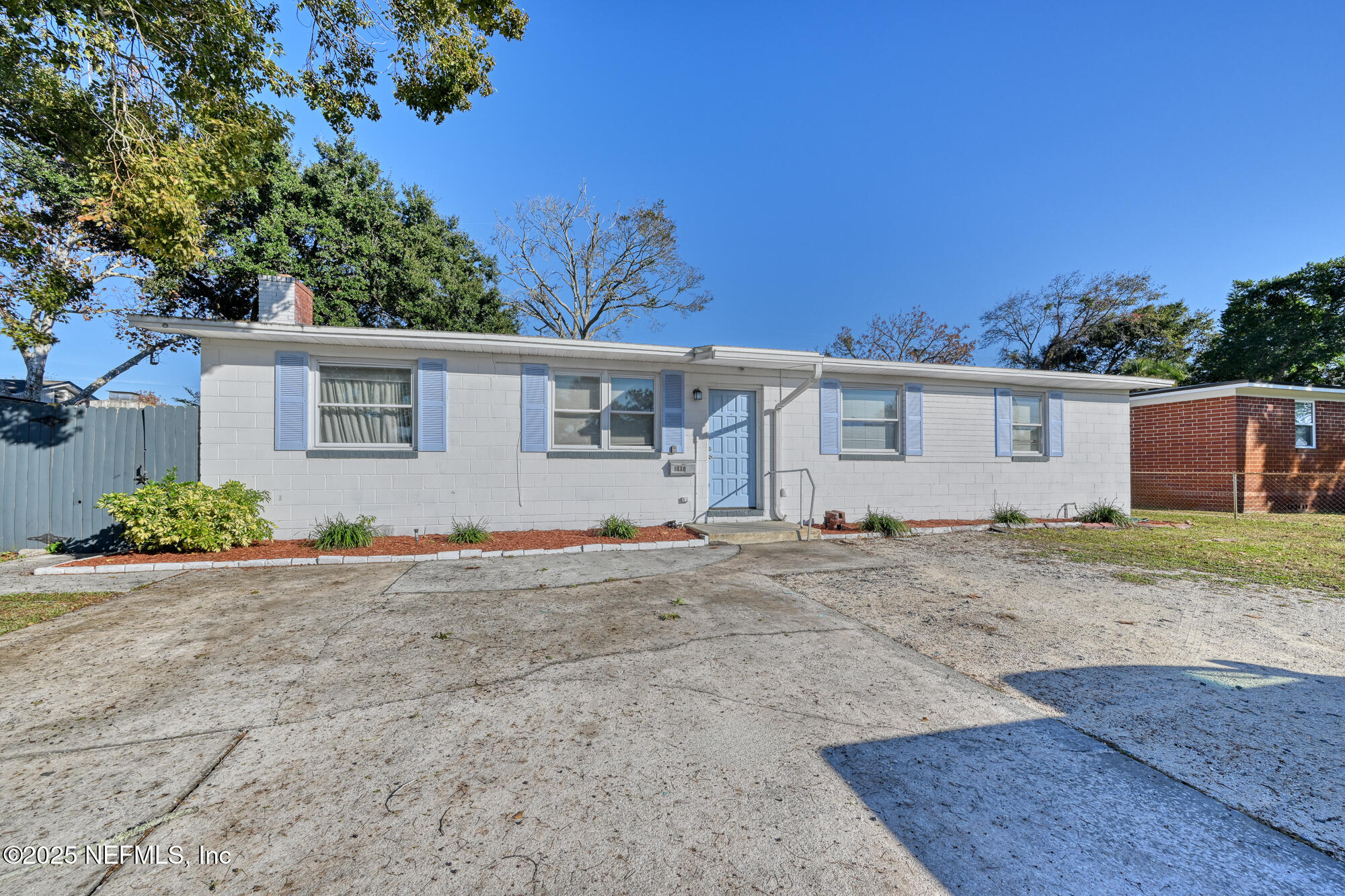 1907 Penman Road Jacksonville Beach, FL 32250 - Photo 4 of 27 front view of a house with a dry yard