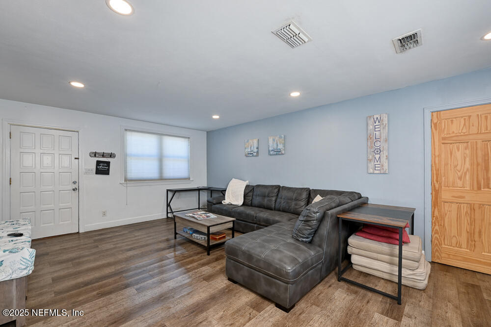 1907 Penman Road Jacksonville Beach, FL 32250 - Photo 5 of 27 a living room with furniture and a wooden floor
