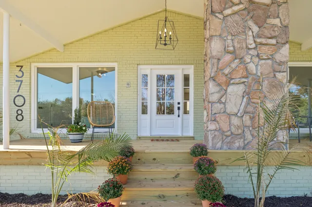 a front view of a house with a glass door