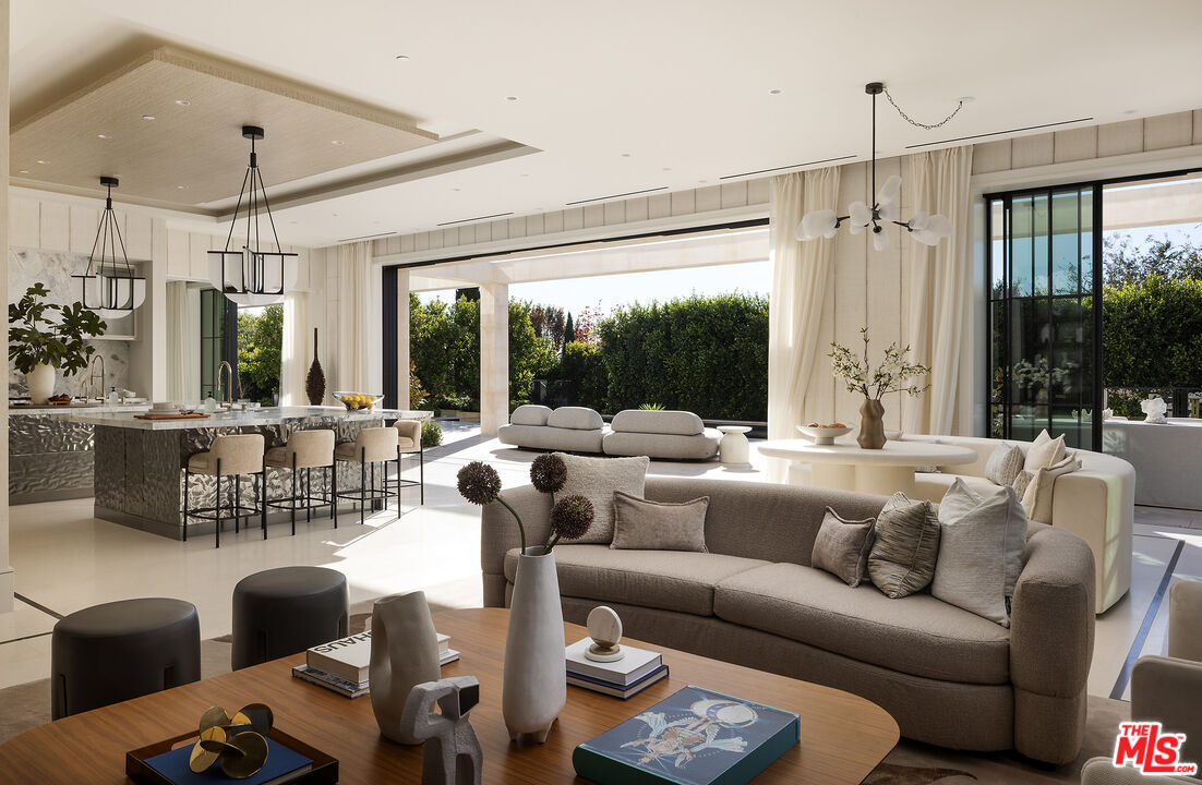 721 North Bonhill Road Los Angeles, CA 90049 - Photo 18 of 64 a living room with furniture and a large window