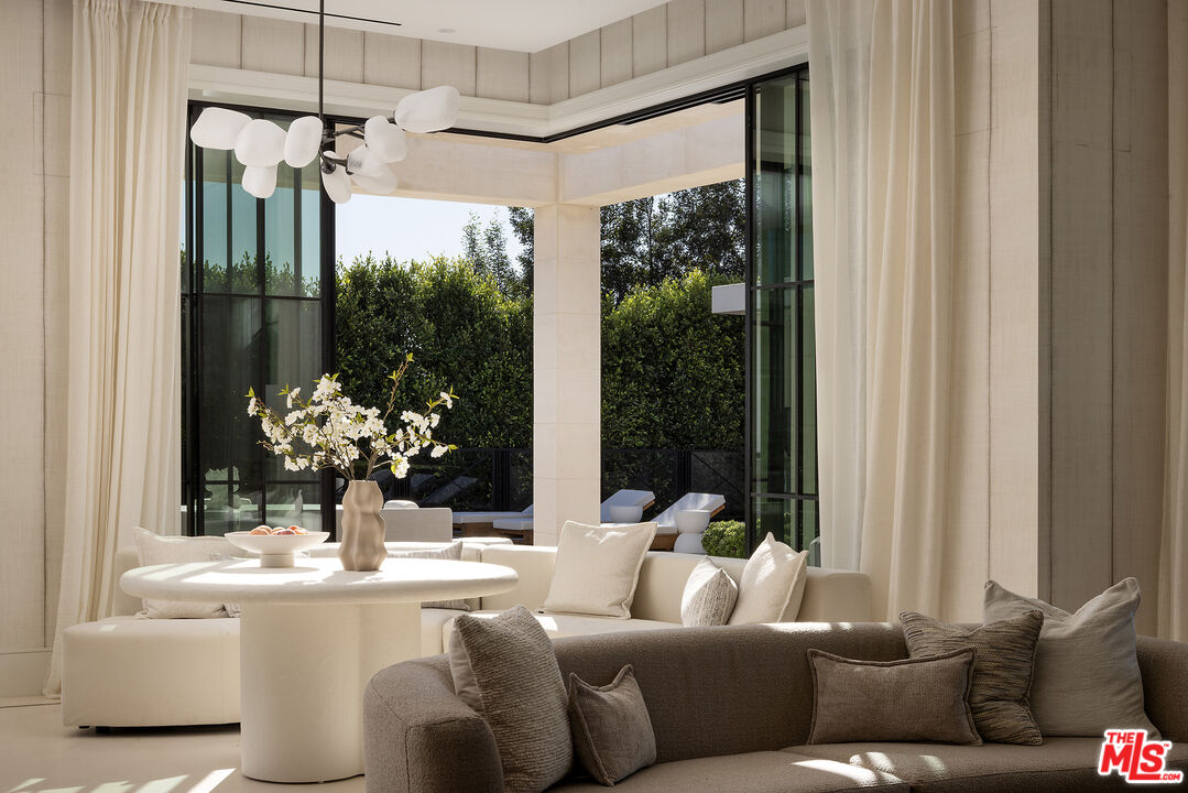 721 North Bonhill Road Los Angeles, CA 90049 - Photo 19 of 64 a living room with furniture and a large window