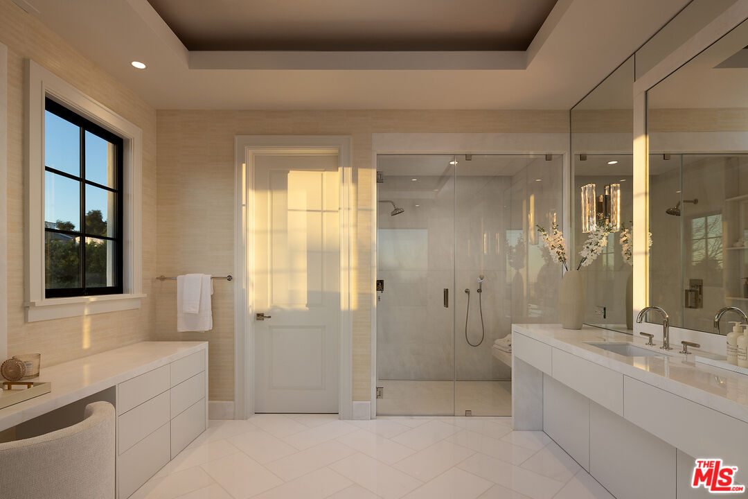 721 North Bonhill Road Los Angeles, CA 90049 - Photo 30 of 64 a bathroom with a double vanity sink toilet and shower