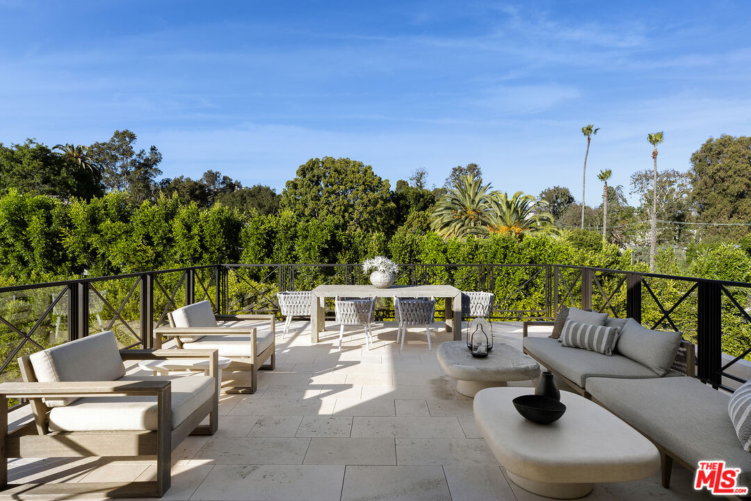 721 North Bonhill Road Los Angeles, CA 90049 - Photo 39 of 64 a view of a patio with couches and chairs with potted plants