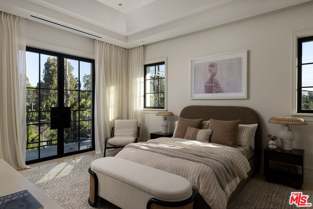 721 North Bonhill Road Los Angeles, CA 90049 - Photo 40 of 64 a bedroom with a bed and glass window