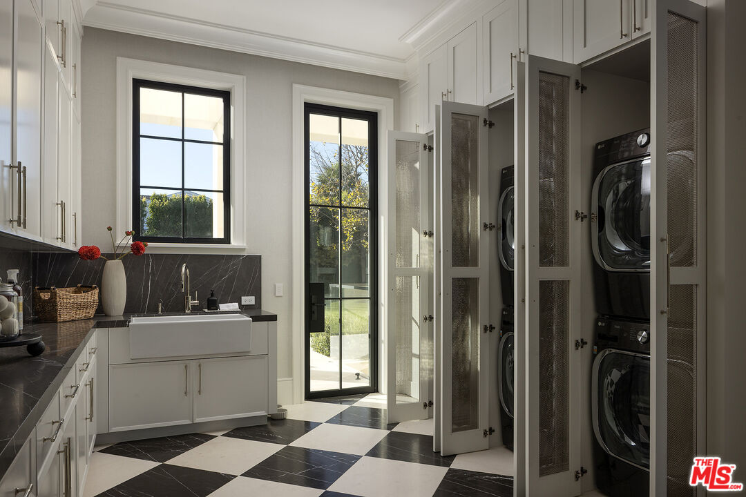 721 North Bonhill Road Los Angeles, CA 90049 - Photo 43 of 64 a room with a black white checkered floor storage and utility