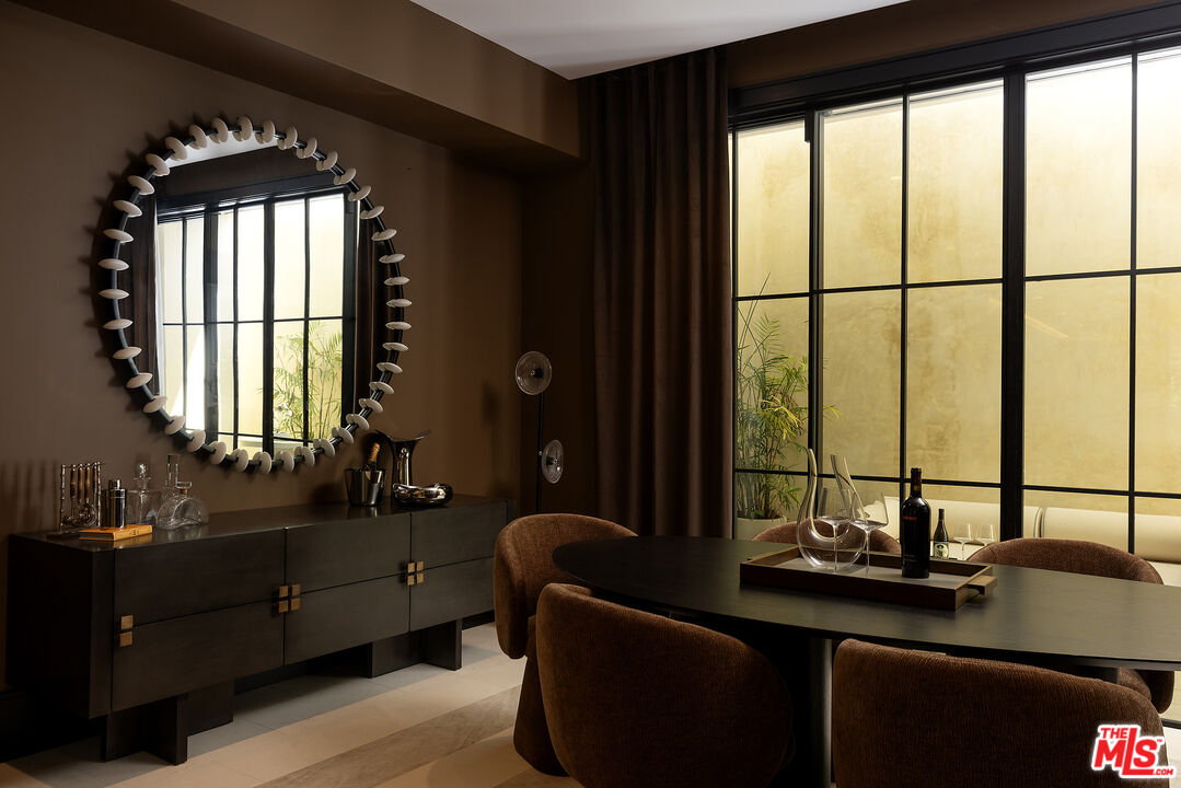 721 North Bonhill Road Los Angeles, CA 90049 - Photo 52 of 64 a bathroom with a double vanity sink and a window